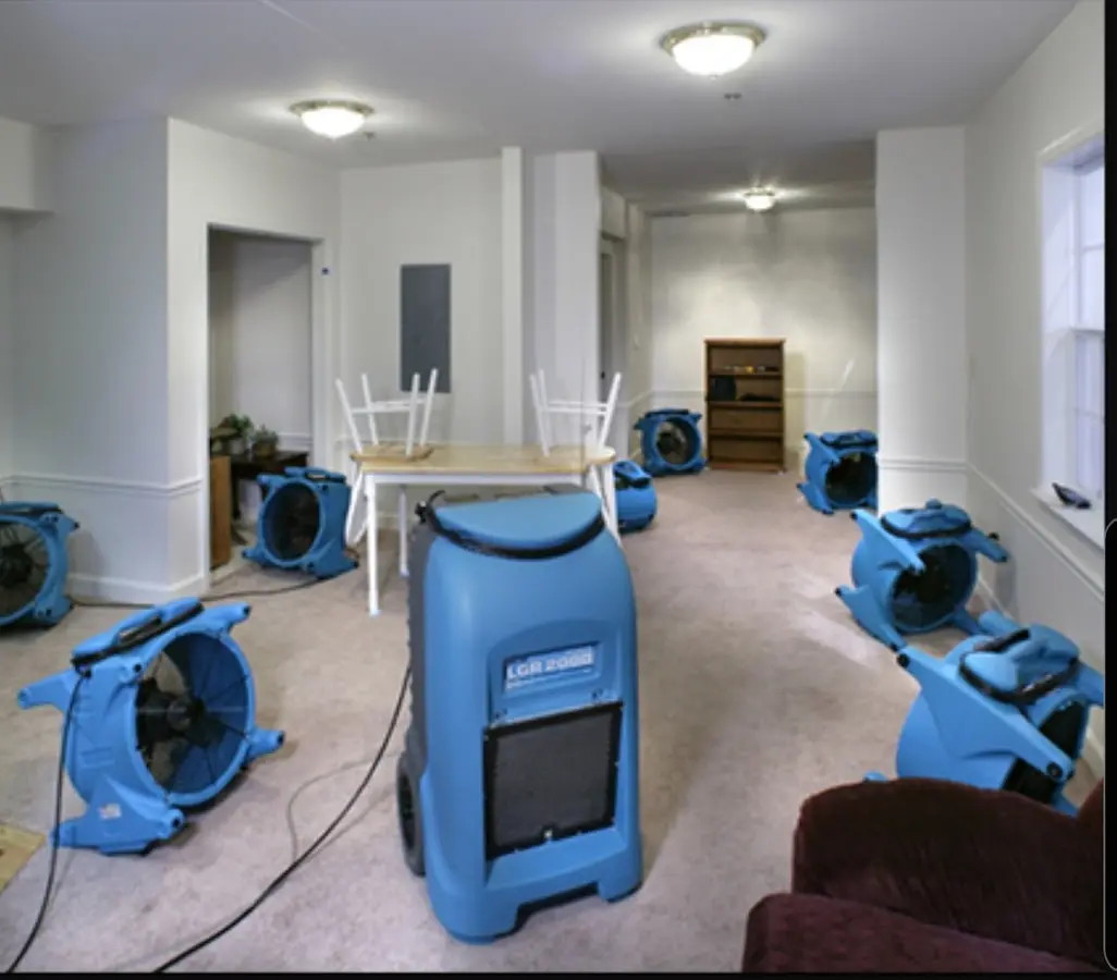 Air movers and dehumidifier setup for Water Damage Restoration in Douglass